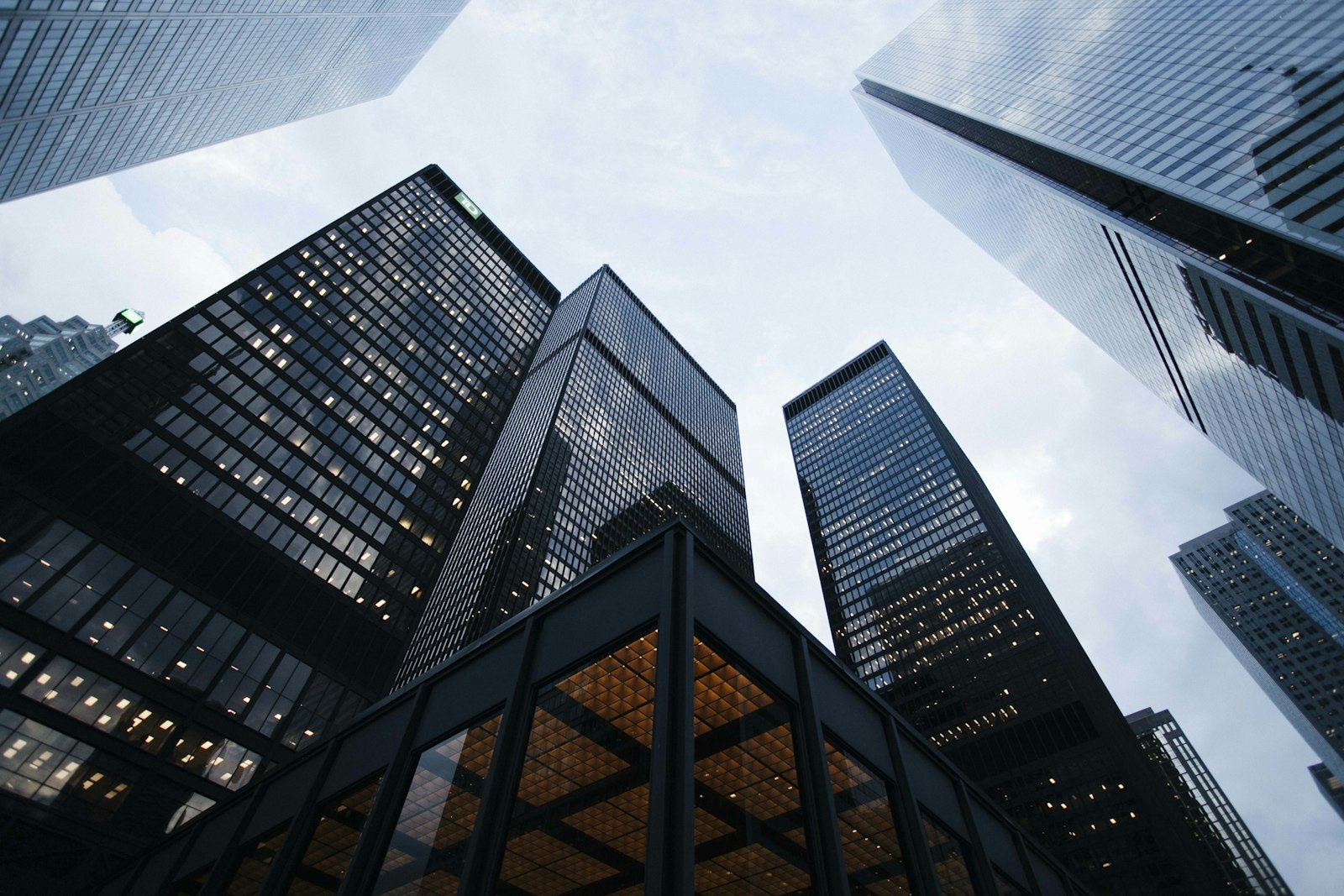 A modern UK city financial district at dusk, representing the corporate environment in which divestment decisions are made.